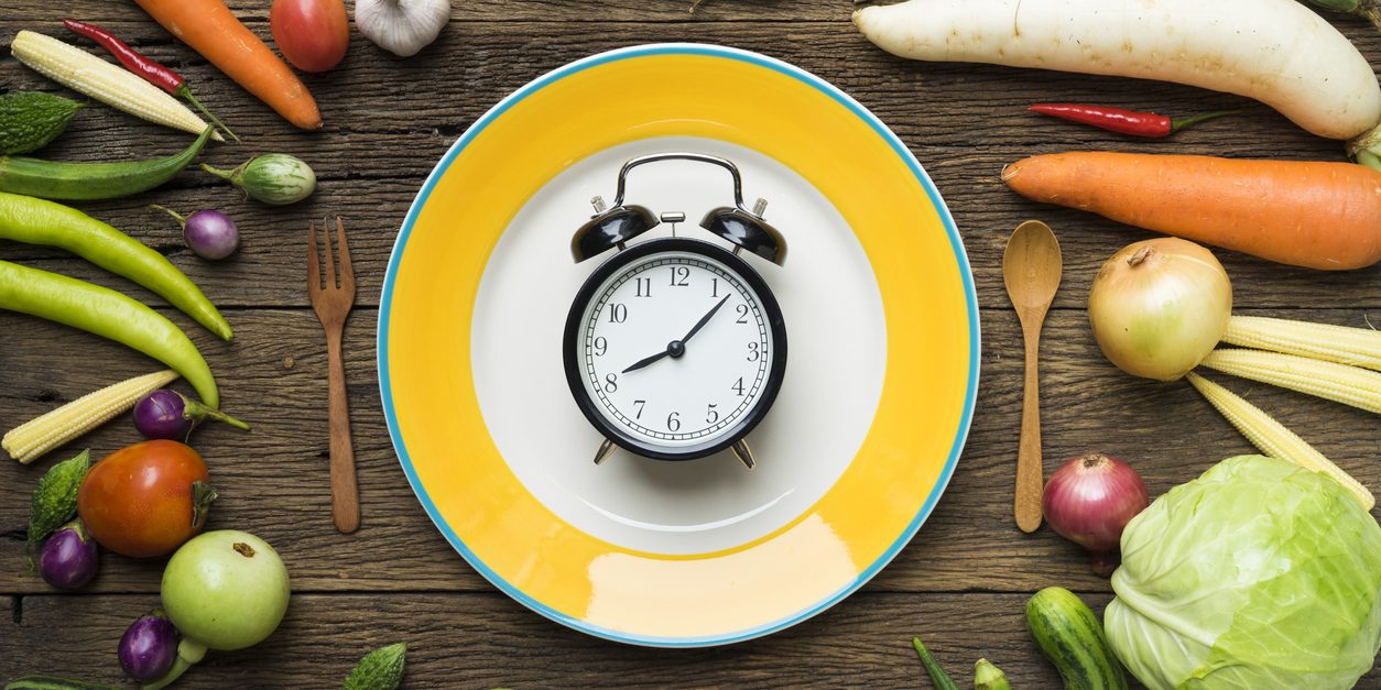 Food clock. Healthy food concept on wooden table